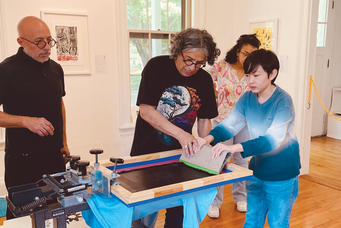A screen printing demonstration at the Print 4 Fun event