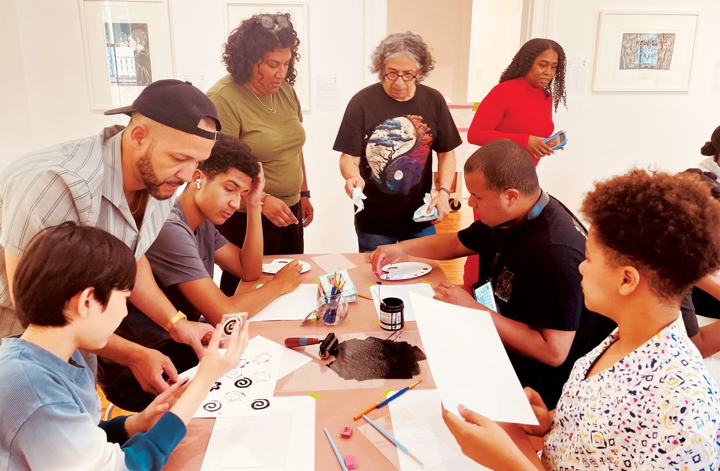 Parents and children at work during the Print 4 Fun art workshop